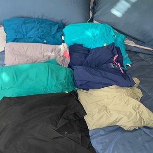 7 pairs of scrubs! Used. Brands: wonder wink, Cherokee, greys anatomy, and tabby